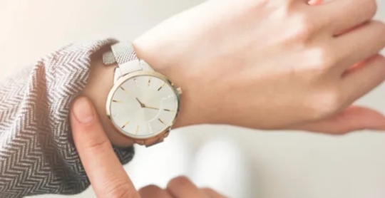 A person looking at the time