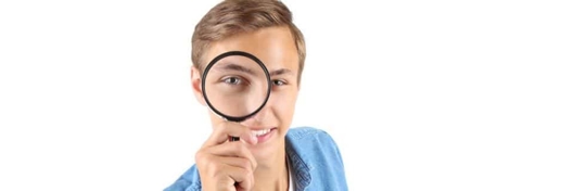 Person looking through a magnifying glass in a digital media content editing interface.