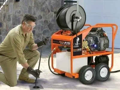 A plumber with a machine that help with clogs