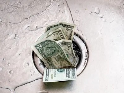 Dollar bills in the drain