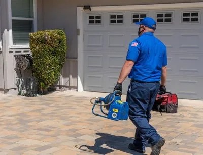 A plumber carrying a tools for plumbing